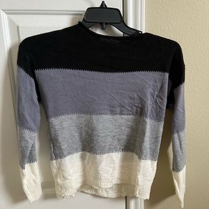 Black, gray, and white striped sweater